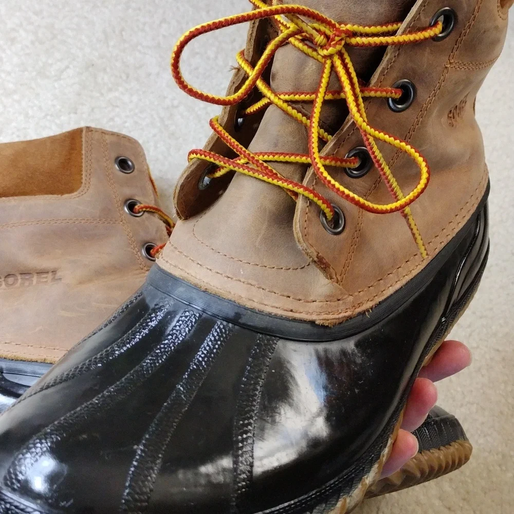 Sorel men's black rubber & tan leather winter boots. Size 11.5
